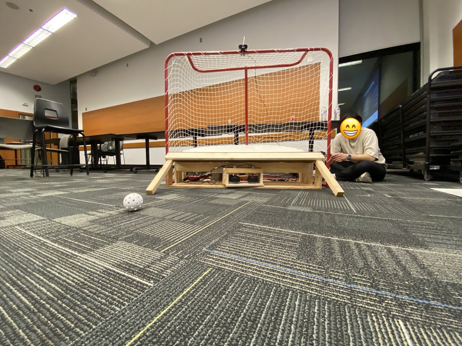 Puck Pal automated hockey puck return system mounted on a hockey net
